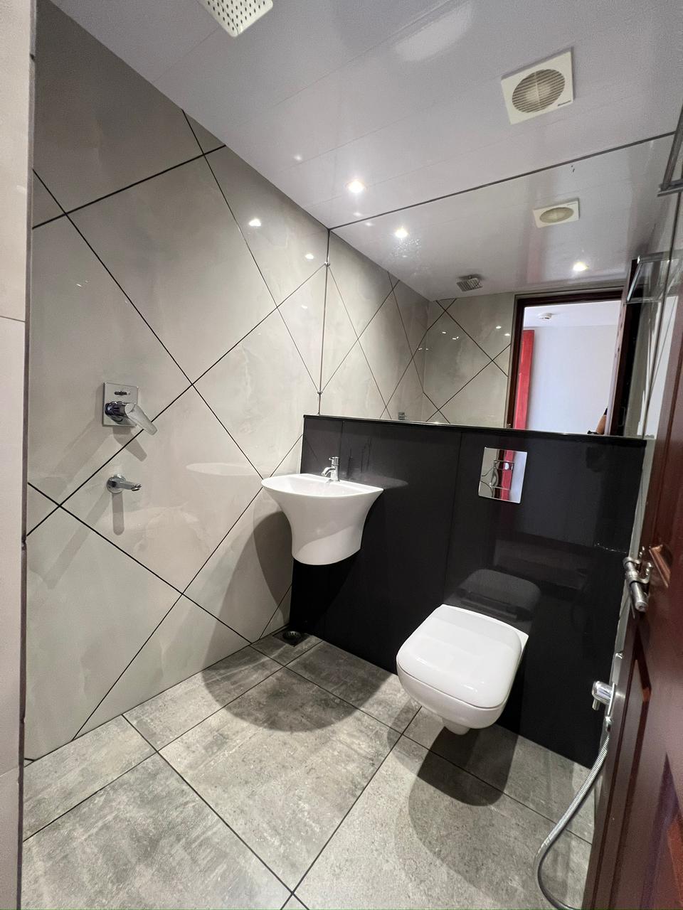 Modern tiled bathroom with walk-in shower